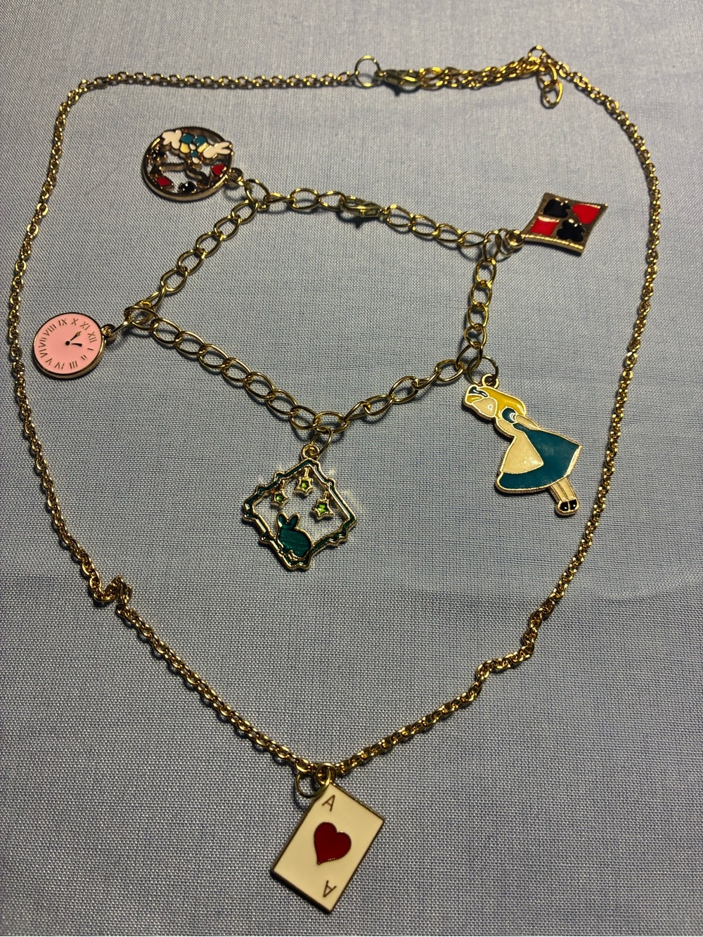 Gold-Tone Alice in Wonderland Charm Necklace Set - Blue, Teal, Red Accents